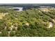 Aerial view of a large lot with mature trees near a lake at 15669 Se 112Th Ln, Ocklawaha, FL 32179