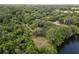 Aerial view of waterfront property with lush vegetation at 15669 Se 112Th Ln, Ocklawaha, FL 32179