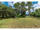 Relaxing backyard with a fire pit and seating area at 15669 Se 112Th Ln, Ocklawaha, FL 32179