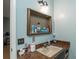 Bathroom vanity with sink and mirrored medicine cabinet at 15669 Se 112Th Ln, Ocklawaha, FL 32179