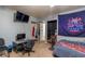 Bedroom with gaming setup and double bed at 15669 Se 112Th Ln, Ocklawaha, FL 32179