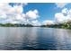 Scenic view of a tranquil lake under a bright blue sky at 15669 Se 112Th Ln, Ocklawaha, FL 32179