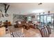 Living room with sectional sofa and view of the screened porch at 15669 Se 112Th Ln, Ocklawaha, FL 32179