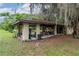 Covered workshop with concrete floor and ample storage space at 15669 Se 112Th Ln, Ocklawaha, FL 32179