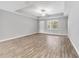 Bright living room featuring hardwood floors and a ceiling fan at 13359 Sw 80Th St, Dunnellon, FL 34432