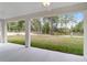 Covered patio overlooking a grassy backyard at 13359 Sw 80Th St, Dunnellon, FL 34432