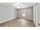 Bright bedroom featuring wood-look flooring and a ceiling fan at 13359 Sw 80Th St, Dunnellon, FL 34432