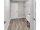 Laundry room with wood-look flooring and built-in shelving at 13359 Sw 80Th St, Dunnellon, FL 34432