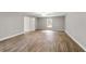 Well-lit bedroom with hardwood floors and large window at 13359 Sw 80Th St, Dunnellon, FL 34432