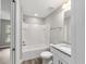 Clean bathroom with white vanity, granite countertop, and a bathtub at 13359 Sw 80Th St, Dunnellon, FL 34432