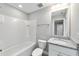 Clean bathroom with white vanity, granite countertop, and a bathtub at 13359 Sw 80Th St, Dunnellon, FL 34432