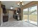 Kitchen features dark brown cabinets, granite countertops, and a sliding glass door at 83 Malauka Radl, Ocklawaha, FL 32179
