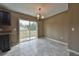 Bright dining area with tile floors and sliding glass doors leading to backyard at 115 Malauka Radl, Ocklawaha, FL 32179