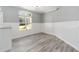 Bright dining room with white wainscoting and hardwood floors at 10020 Sw 202Nd Cir, Dunnellon, FL 34431
