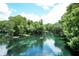 Kayakers enjoy a serene river with lush vegetation at 10020 Sw 202Nd Cir, Dunnellon, FL 34431