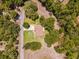 Aerial view of a single Gathering home situated on a large lot with mature trees at 10020 Sw 202Nd Cir, Dunnellon, FL 34431