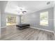 Spacious bedroom with vinyl flooring and sliding glass doors to patio at 10020 Sw 202Nd Cir, Dunnellon, FL 34431