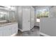 Updated bathroom with granite countertop and walk-in shower at 10020 Sw 202Nd Cir, Dunnellon, FL 34431