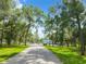 Tree-lined path leading to community clubhouse at 10020 Sw 202Nd Cir, Dunnellon, FL 34431