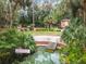 Stunning view of a natural spring with steps leading into the water at 10020 Sw 202Nd Cir, Dunnellon, FL 34431
