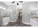 Double vanity bathroom with granite countertops and grey tile floors at 10020 Sw 202Nd Cir, Dunnellon, FL 34431