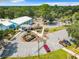 Aerial view of clubhouse parking lot with cars at 10020 Sw 202Nd Cir, Dunnellon, FL 34431
