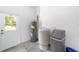 Garage area with water heater, water softener, and exterior door at 10020 Sw 202Nd Cir, Dunnellon, FL 34431
