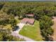 Aerial view of a single Gathering home with a two car garage and spacious yard at 10020 Sw 202Nd Cir, Dunnellon, FL 34431