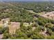 Bird's-eye view of a home situated in a tranquil, wooded neighborhood with paved roads at 10020 Sw 202Nd Cir, Dunnellon, FL 34431