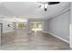 Spacious living area with hardwood floors and a ceiling fan at 10020 Sw 202Nd Cir, Dunnellon, FL 34431
