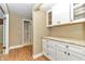 Laundry room with built-in cabinetry and granite countertop at 2309 Se 19Th Cir, Ocala, FL 34471