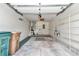 Attached garage with ample storage shelving and space for two cars at 2309 Se 19Th Cir, Ocala, FL 34471