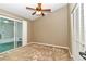 Bright bedroom with carpet, ceiling fan and sliding doors to lanai at 2309 Se 19Th Cir, Ocala, FL 34471