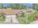 Two-unit condo building with attached garages and landscaped grounds at 2309 Se 19Th Cir, Ocala, FL 34471