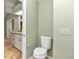 Private toilet area with light-colored walls and flooring at 2309 Se 19Th Cir, Ocala, FL 34471