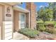 Brick chimney and light tan house exterior with landscaping at 2309 Se 19Th Cir, Ocala, FL 34471