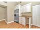 Kitchen boasts white cabinets, granite countertops and stainless steel appliances at 2309 Se 19Th Cir, Ocala, FL 34471