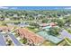 Community overview with a pond, pool, tennis court, and residential units at 2309 Se 19Th Cir, Ocala, FL 34471
