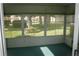 Sunroom with multiple windows and a view of the backyard at 2309 Se 19Th Cir, Ocala, FL 34471