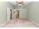 Large Primary bedroom with carpet, ceiling fan and en-suite bathroom at 2309 Se 19Th Cir, Ocala, FL 34471