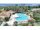 Community pool area with a covered patio and surrounding green space at 2309 Se 19Th Cir, Ocala, FL 34471