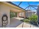 Covered patio with screened enclosure, perfect for outdoor relaxation at 10145 Sw 89Th Loop, Ocala, FL 34481