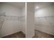 Spacious walk-in closet with double rods and carpeted floor at 10145 Sw 89Th Loop, Ocala, FL 34481