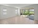 Bright living room with sliding glass doors leading to the backyard at 10145 Sw 89Th Loop, Ocala, FL 34481
