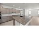 Modern kitchen with granite island and stainless steel appliances at 10145 Sw 89Th Loop, Ocala, FL 34481