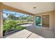 Spacious screened patio with view of lush greenery and golf course at 10145 Sw 89Th Loop, Ocala, FL 34481