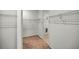 Large walk-in closet with wire shelving and carpeted floor at 10145 Sw 89Th Loop, Ocala, FL 34481
