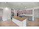Spacious kitchen with granite countertops and gray cabinets at 10145 Sw 89Th Loop, Ocala, FL 34481