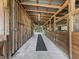 Spacious barn with multiple stalls and a long center aisle at 4344 Cr 542H, Bushnell, FL 33513