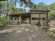 Exterior view of a rustic barn with several horse stalls at 4344 Cr 542H, Bushnell, FL 33513